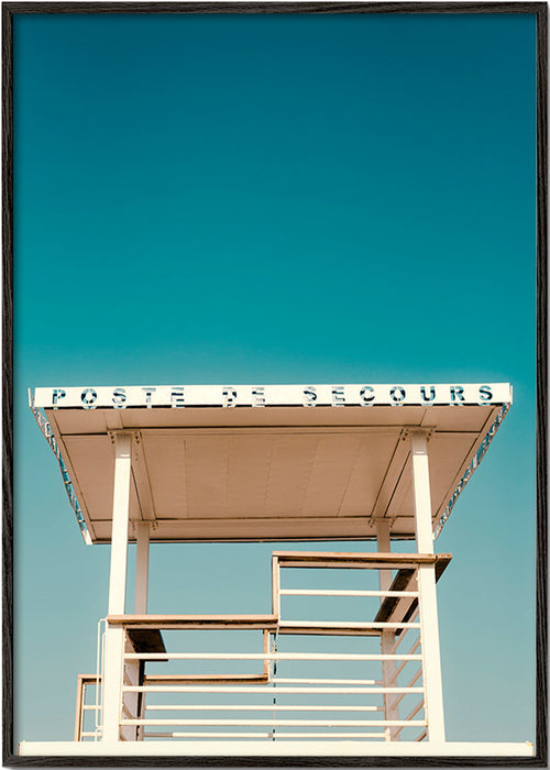 Fotografía: poste de secours sobre cielo azul – Black Frame