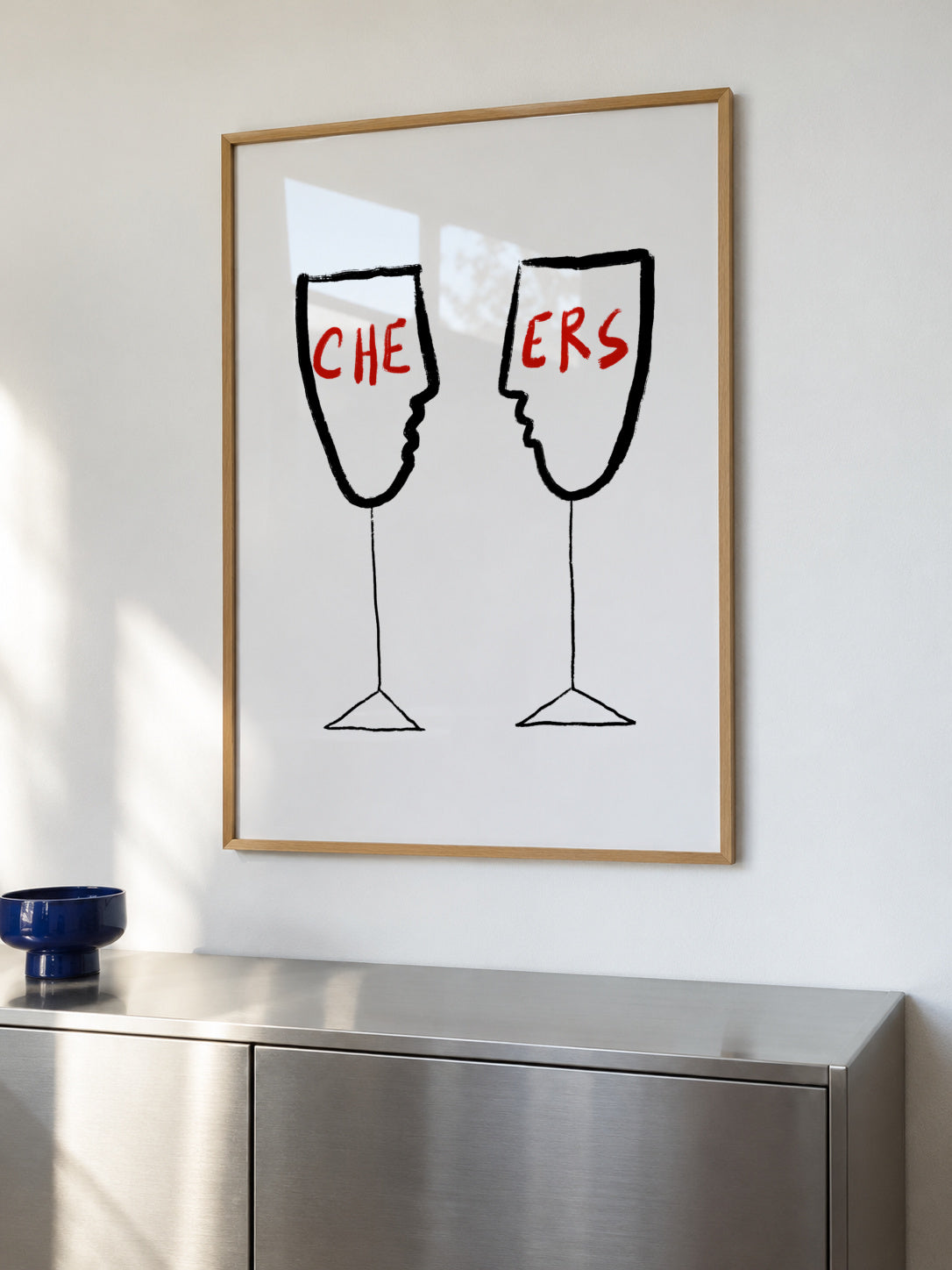Cheers - Framed poster in an interior