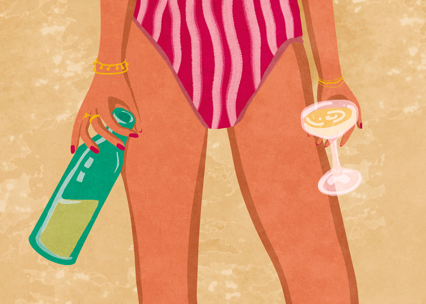 Girl with wine at the beach