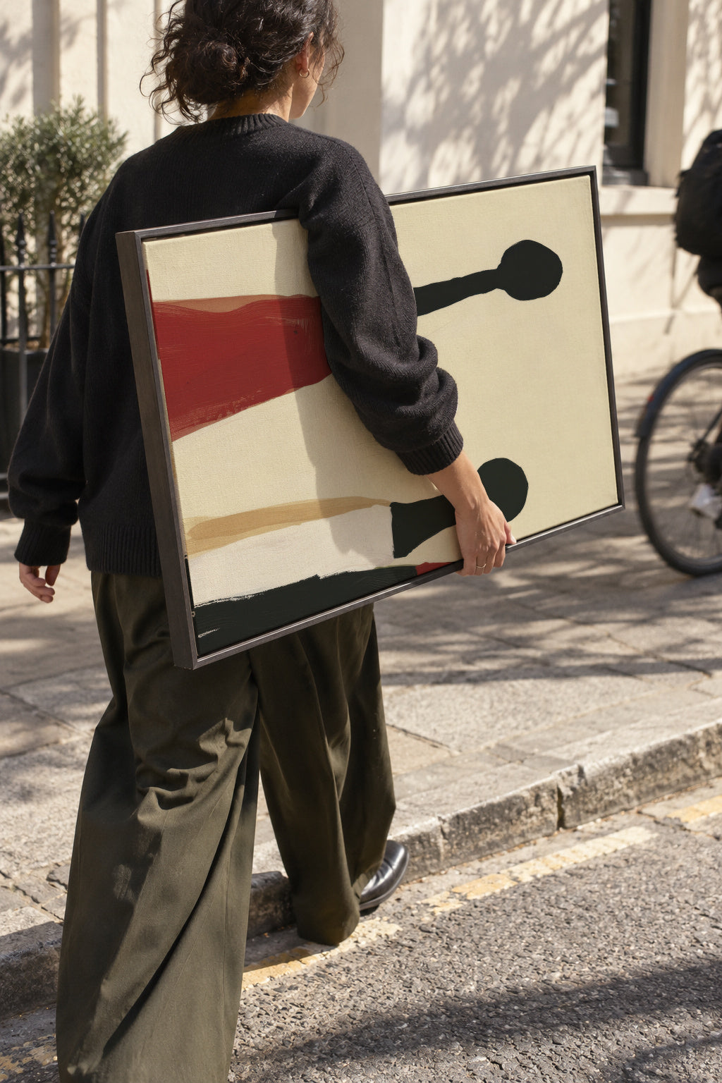 Red Skirt Figures - Framed canvas in an interior